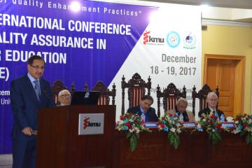 02- VC KMU Talking to Conferece while  Sectery HED Syed Zafar Ali shah, Member Ops & Planing Dr Ghulam Raza Bhatti setting on stage during first International conference on qulaity assurance (Custom)1513657699.JPG