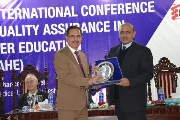 03- VC  KMU Dr. Arshad Javiad presenting seveniour to Chairman Pakistan science Foundation during concluding session of 1st Internation Conferenc on Quality Assurance (Custom)1514451798.JPG