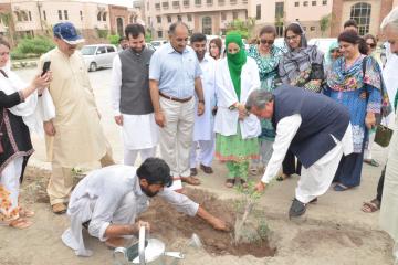 6.DGHS KP Dr Ayub Roze planting  tree during  opening ceremony of tree plantation compaign at KMU (Custom)1534403633.JPG