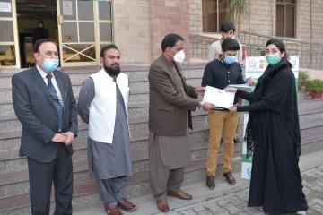 03. DG Health Dr. Niaz Muhammad  awarding certificate at the end of three days  workshop on  Biosafty (Custom)1612852568.JPG